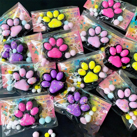 Jucarie Antistres Squishy, Cyrax, cu Revenire Lenta, Squeeze Pinch Family, Model Labuta de Pisica, 6.8x6.2 cm, 55g, Ambalaj Transparent, Galben