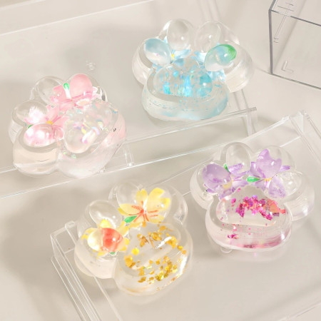 Jucarie Antistres Squishy, Cyrax, Labuta de Pisica Pufoasa, cu Revenire Lenta, 7 x 6.5 cm, Model Flori 2, Transparent