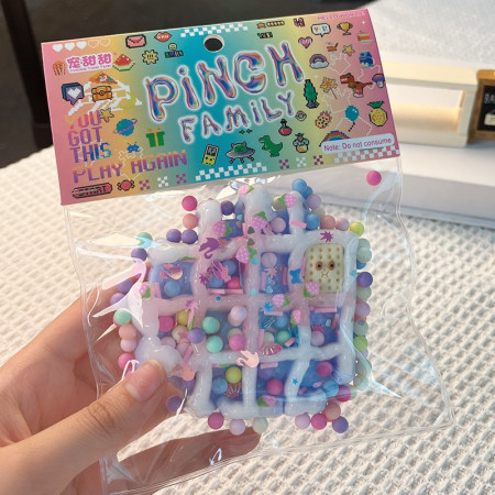 Jucarie Antistres Squishy, Cyrax, cu Revenire Lenta, Squeeze Pinch Family, Model Waffle, 6x6 cm, 99g, Ambalaj Transparent, Multicolor