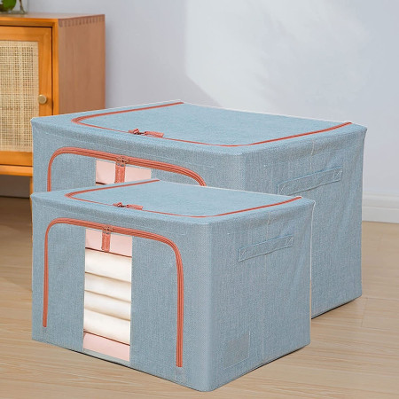 Cutie de Depozitare Pliabila,  100 L, din Bumbac si In, 60x42x40 cm, 2 Ferestre, Frontala si Laterala, 2 Usi de Acces cu Fermoar Bidirectional, Cadru Metalic, Suport Baza Stabil din Plastic, Bleu