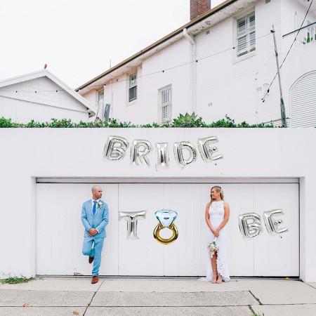 Set Baloane din Folie Metalizata, Cyrax, Model Bride to Be cu Inel de Logodna, Litere de 40 cm, Baloane Party, Ambalaj Individual, Pai Inclus, Umflare cu Aer sau Heliu, Argintiu